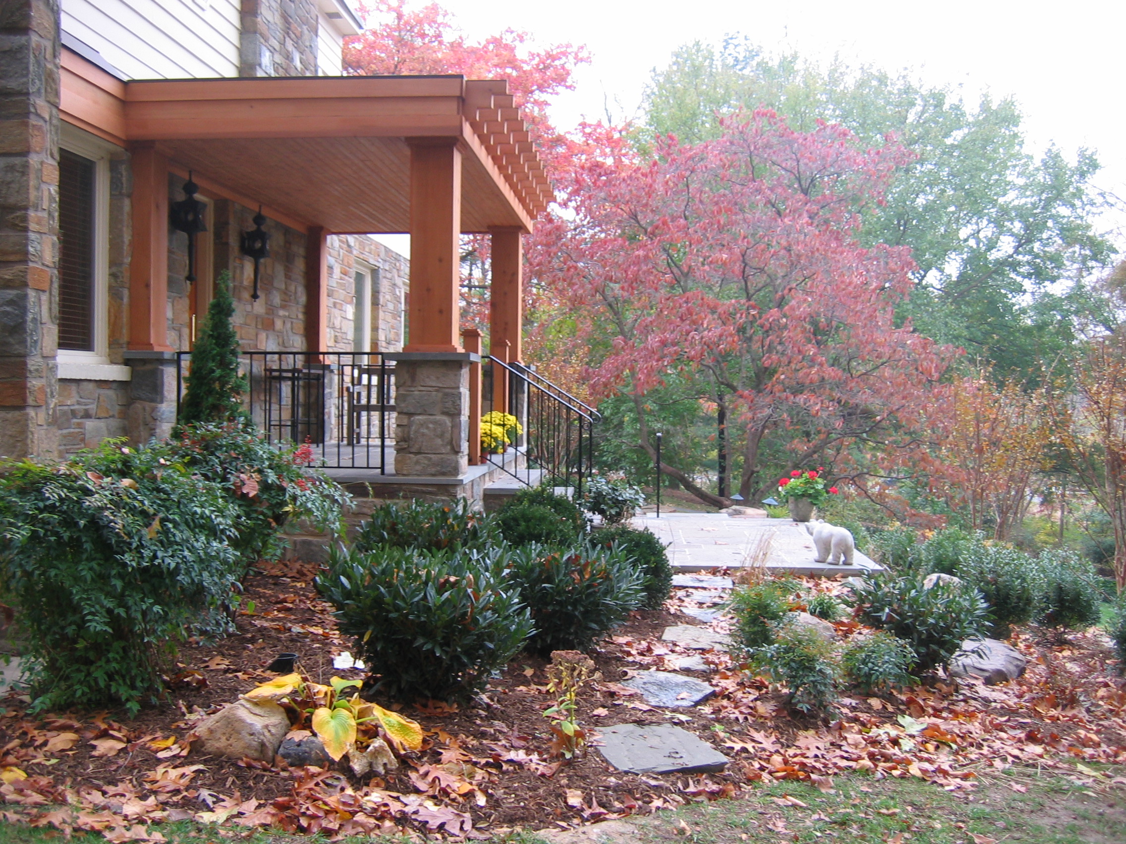 Portico, front stoop and plantings